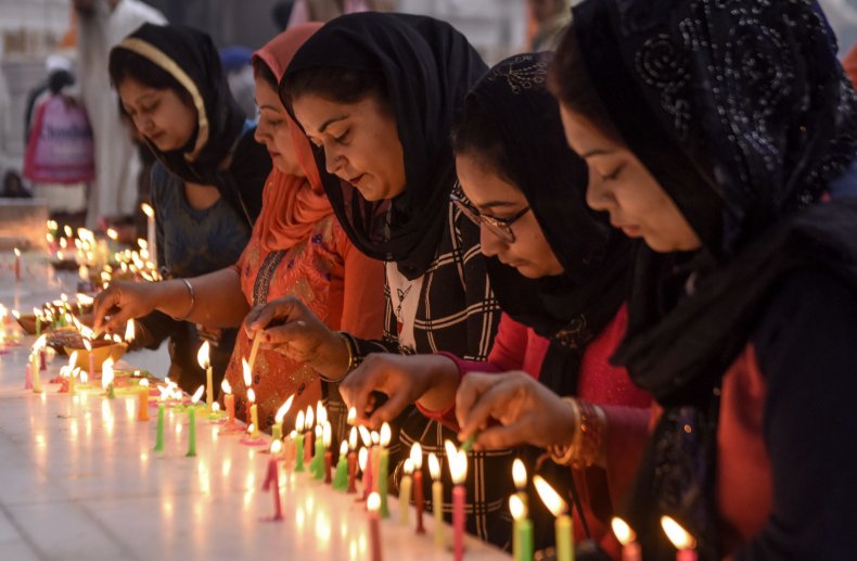 7 Diwali decorations to celebrate the 'Festival of Lights' in style 2 Women light candles during Diwali