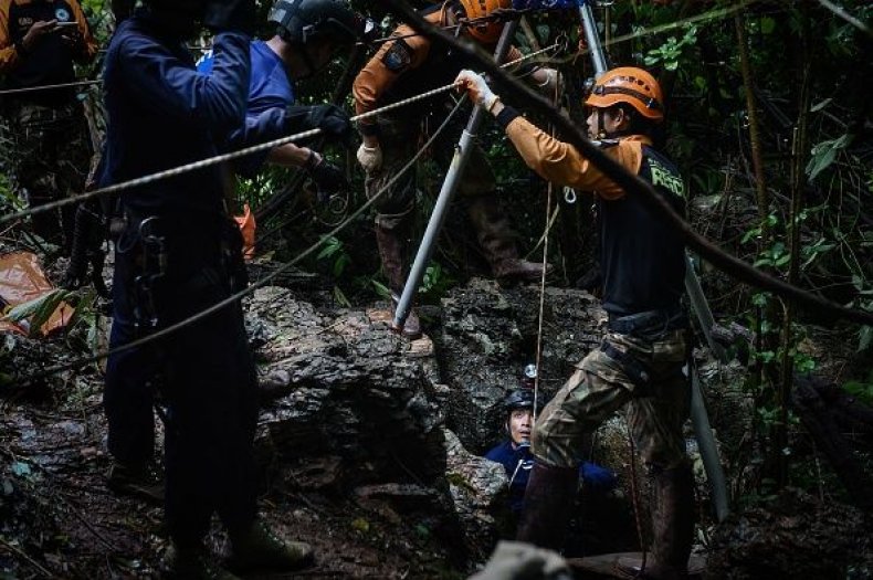 Rescuers Search a Possible Entrance