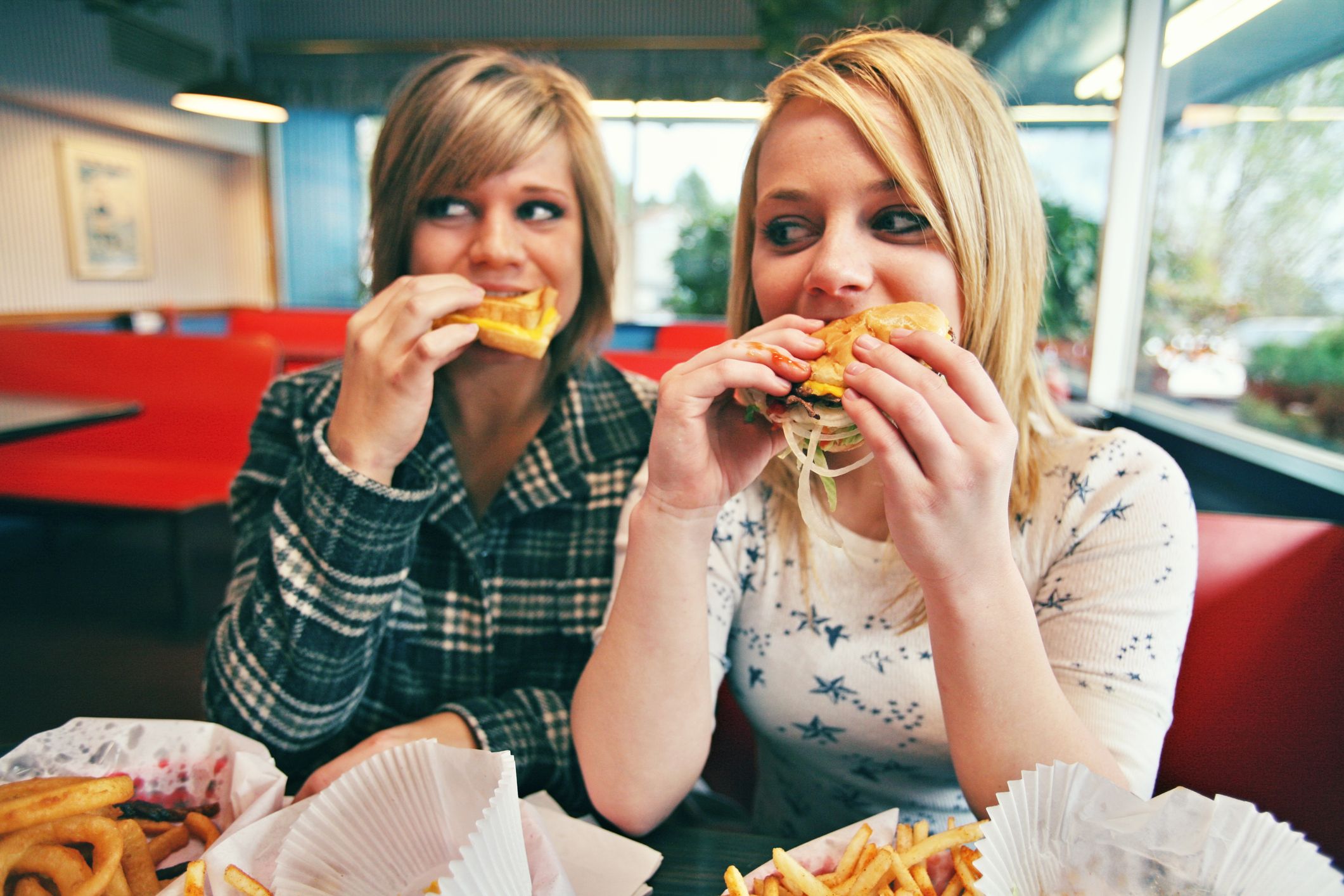 teenagers-burgers-fast-food-stock