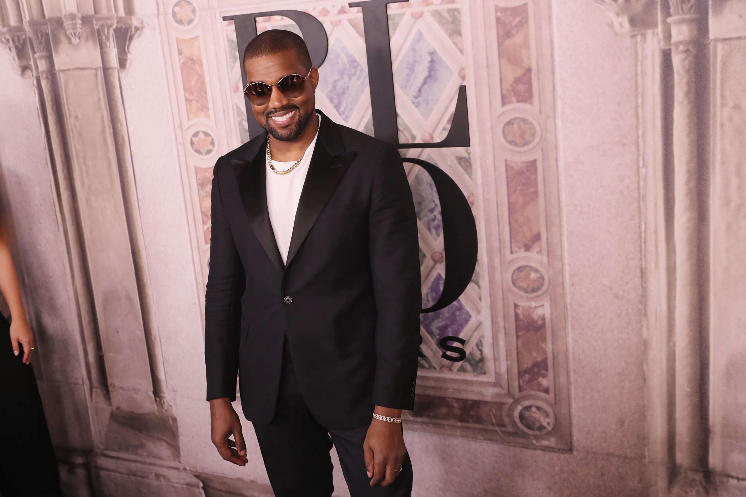 Kanye West leaving his office in a red and blue checkered jacket and  carrying a large Louis Vuitton luggage bag Featuring: Kany Stock Photo -  Alamy