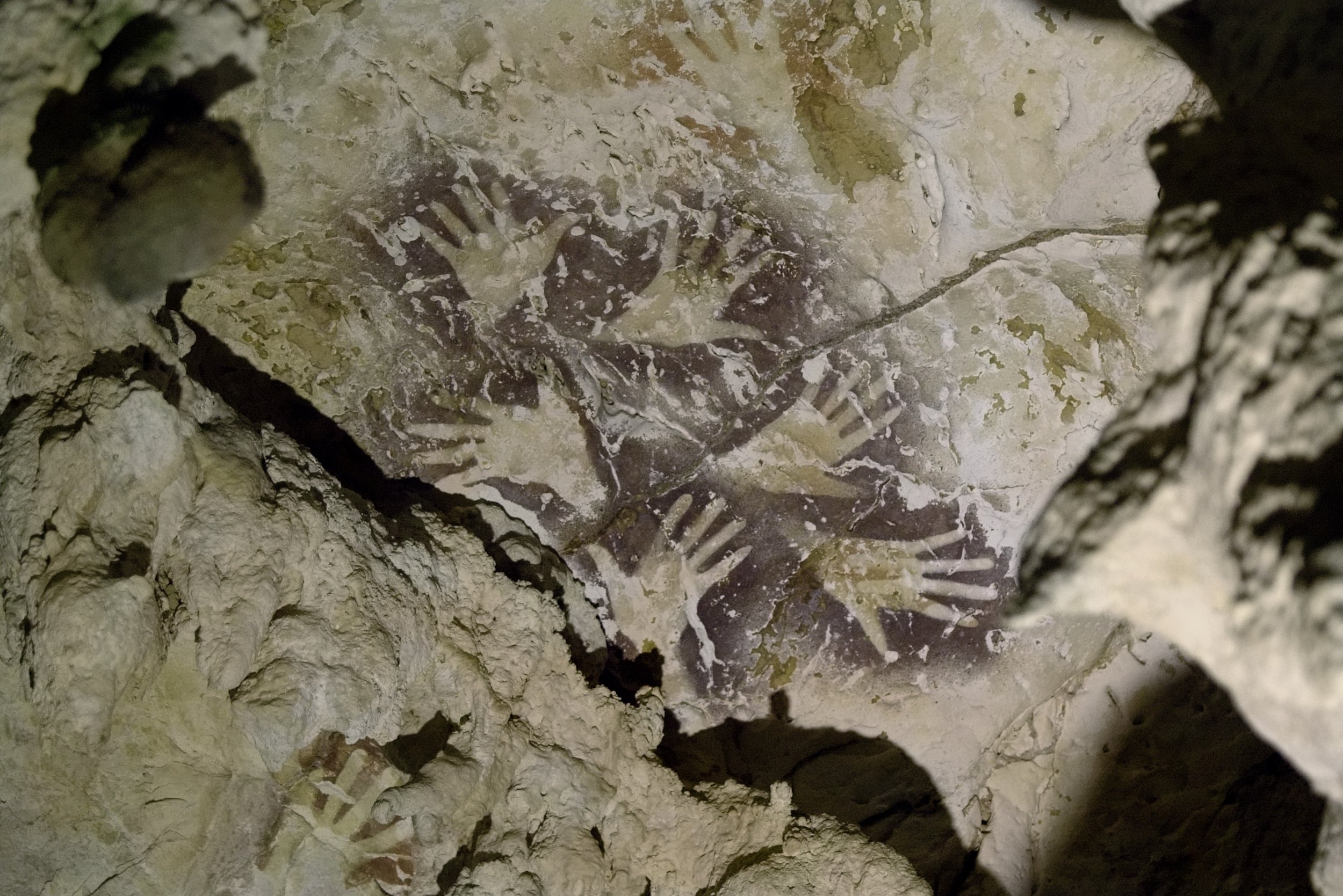 Ochre-and-Mulberry-Panel-of-Hand-Stencils-Gua-Saleh