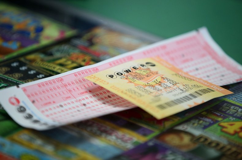 powerball tickets on counter with card