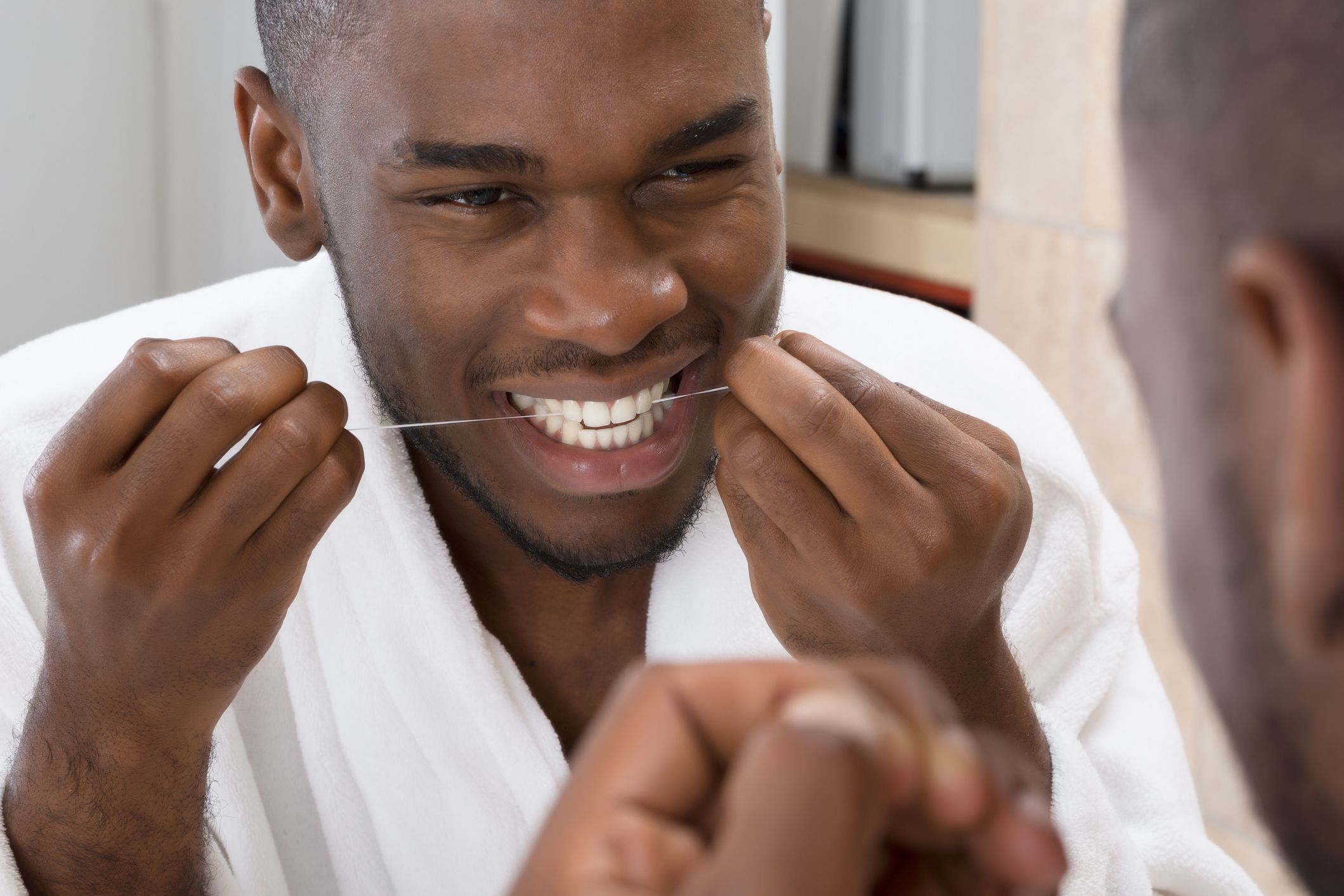 floss teeth getty stock 