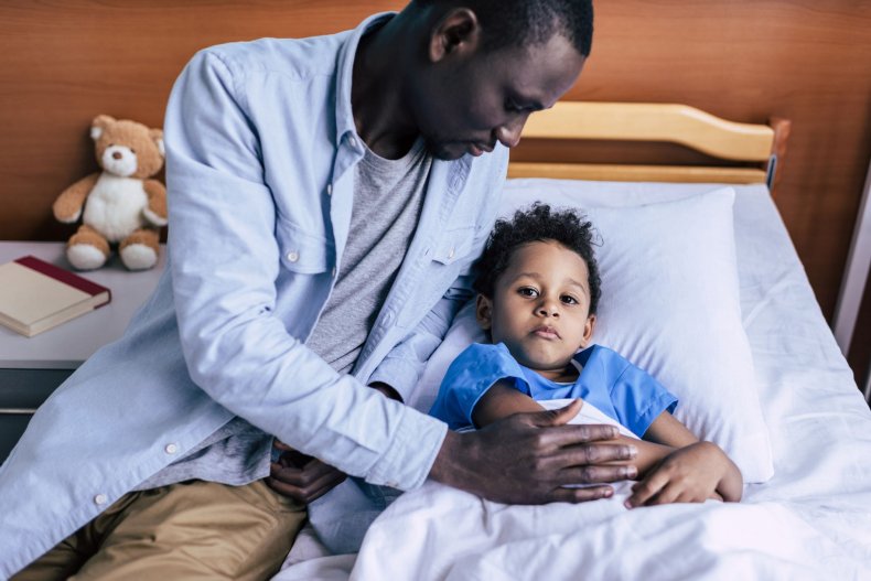 sick child father son stock getty