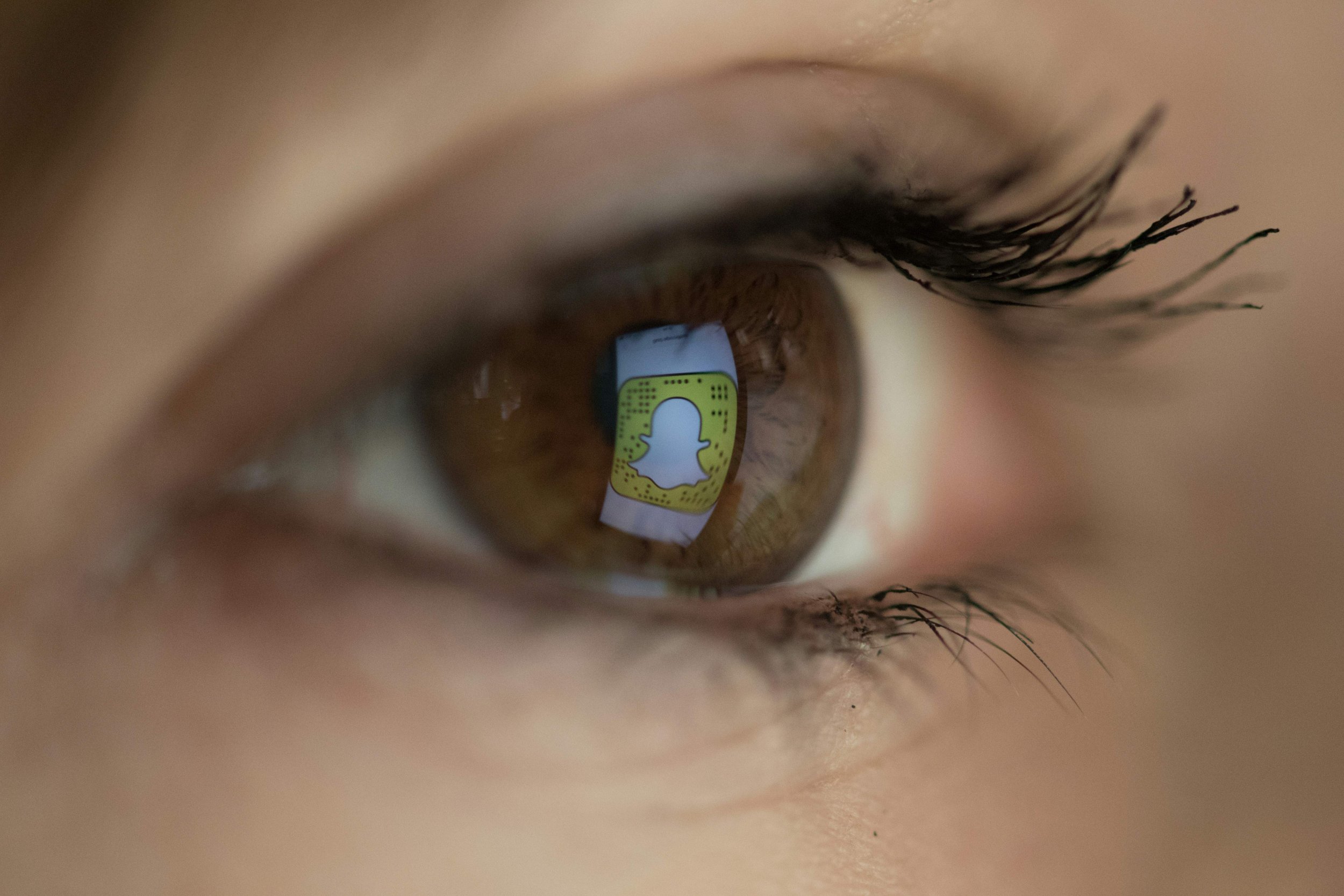 snapchat logo in eye 