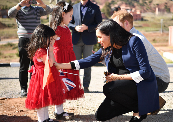 Pictures of Pregnant Meghan Markle and Prince Harry Greeting Children in Morocco and More Photos of Couple's Trip