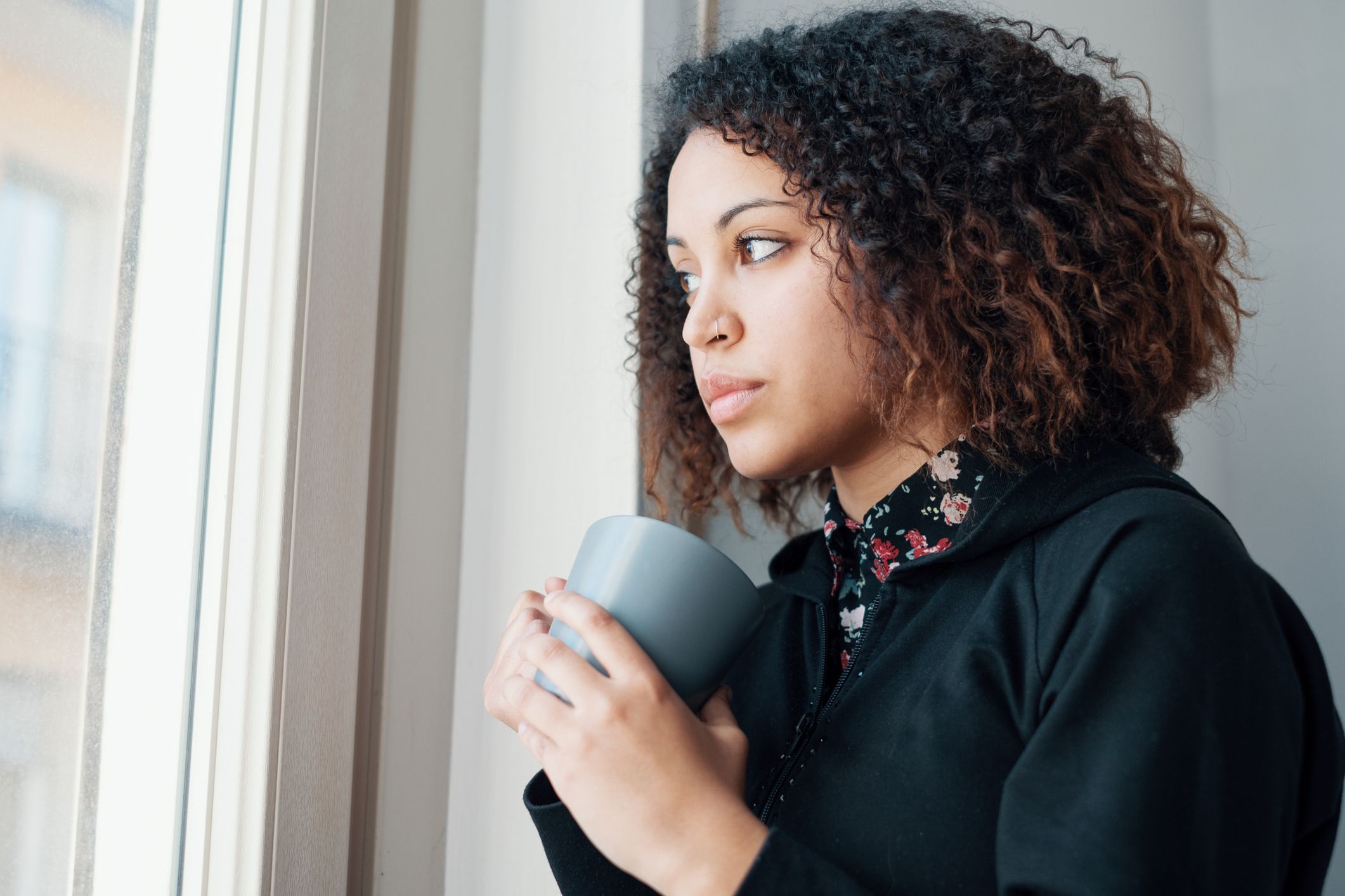 teenager sad window stock getty 