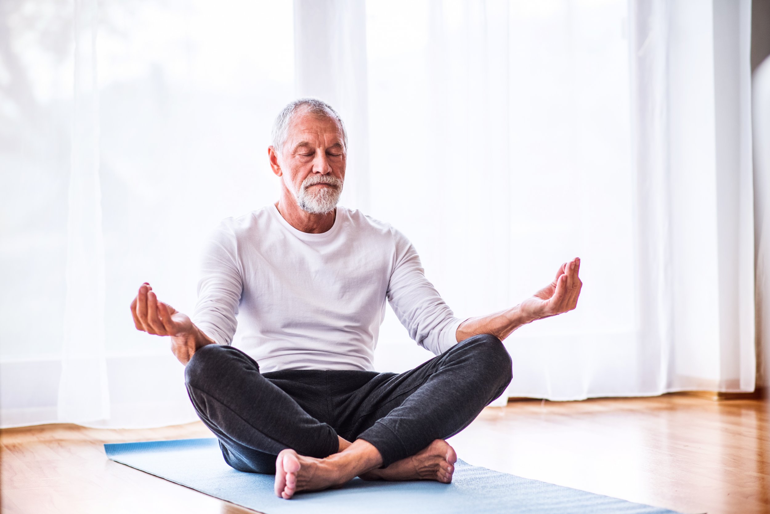 meditation yoga old man stock getty 