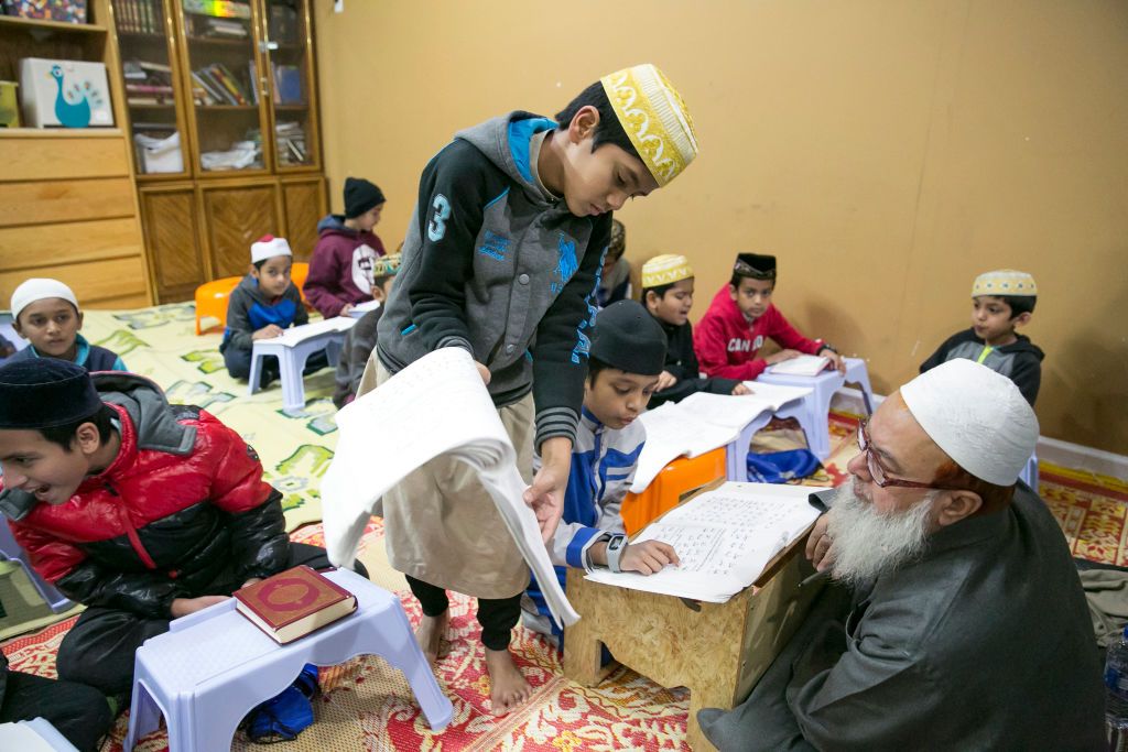 Children participate in a Koran clas