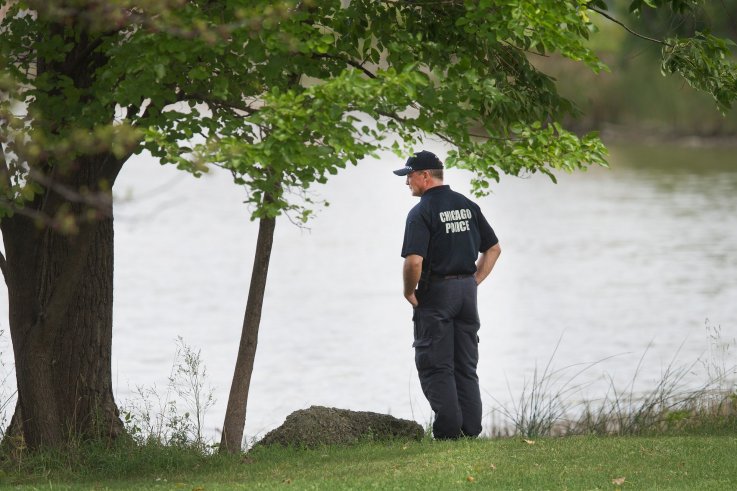Chicago officer inspects lagoon where body of Kyrian Knox was found Chicago officer inspects lagoon where body of Kyrian Knox was found