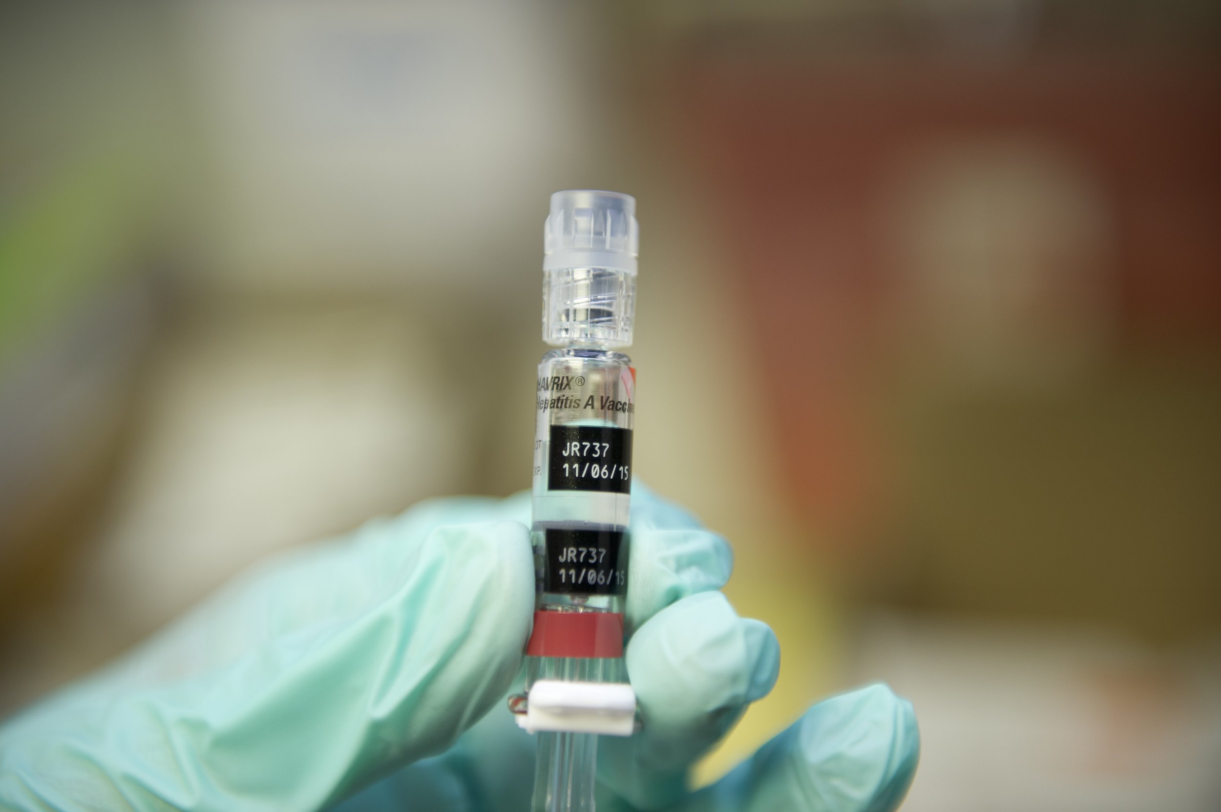 A nurse loads a syringe with a vaccine against hepatitis at a free immunization clinic for students before the start of the school year, in Lynwood, California August, 27, 2013.