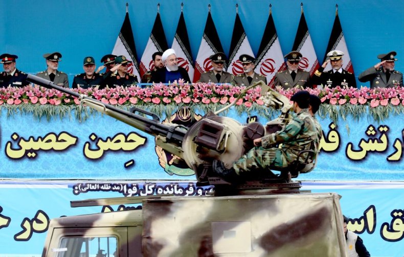 Hassan Rouhani watches Iranian military parade