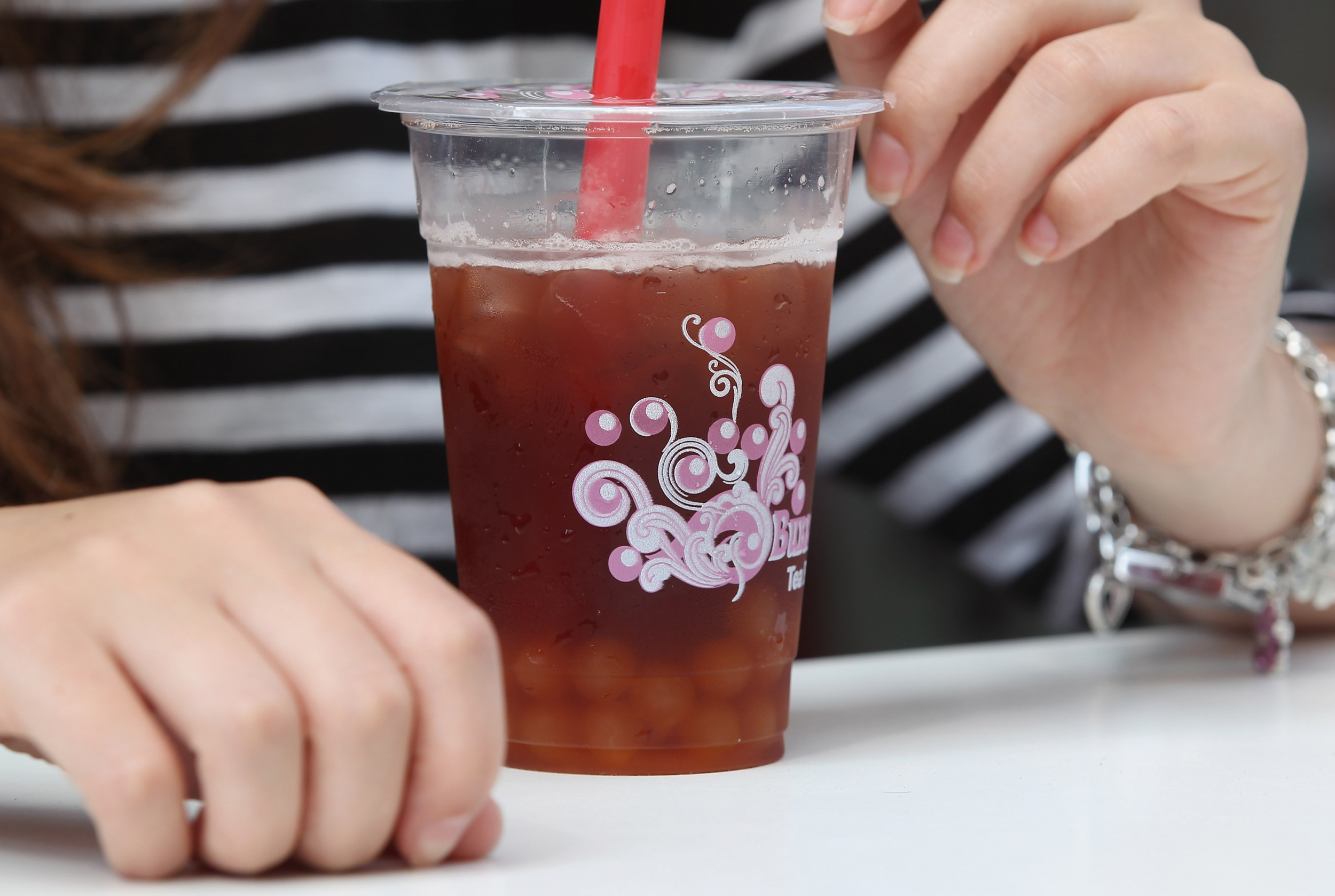 Drinking Bubble Or Boba Tea Adding Atypical Entwine In Tea