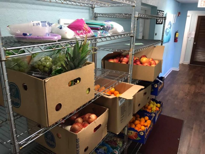 student donates groceries south brevard sharing center