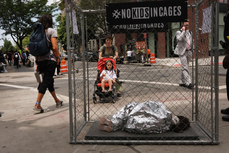 Cage, migrant child, protest