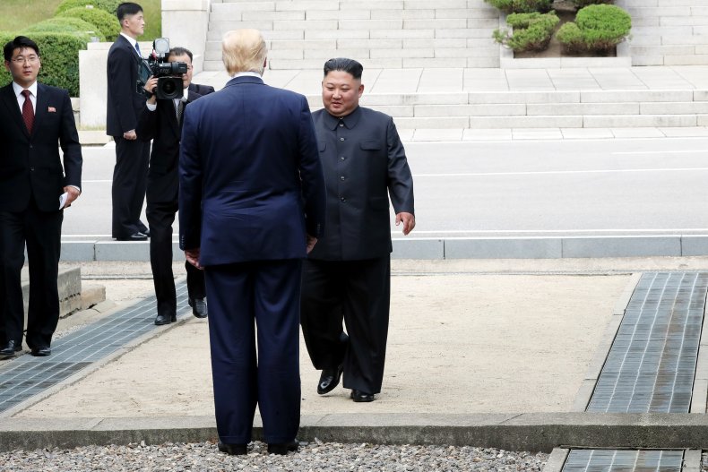 Trump crosses demarcation line to greet Jong-un