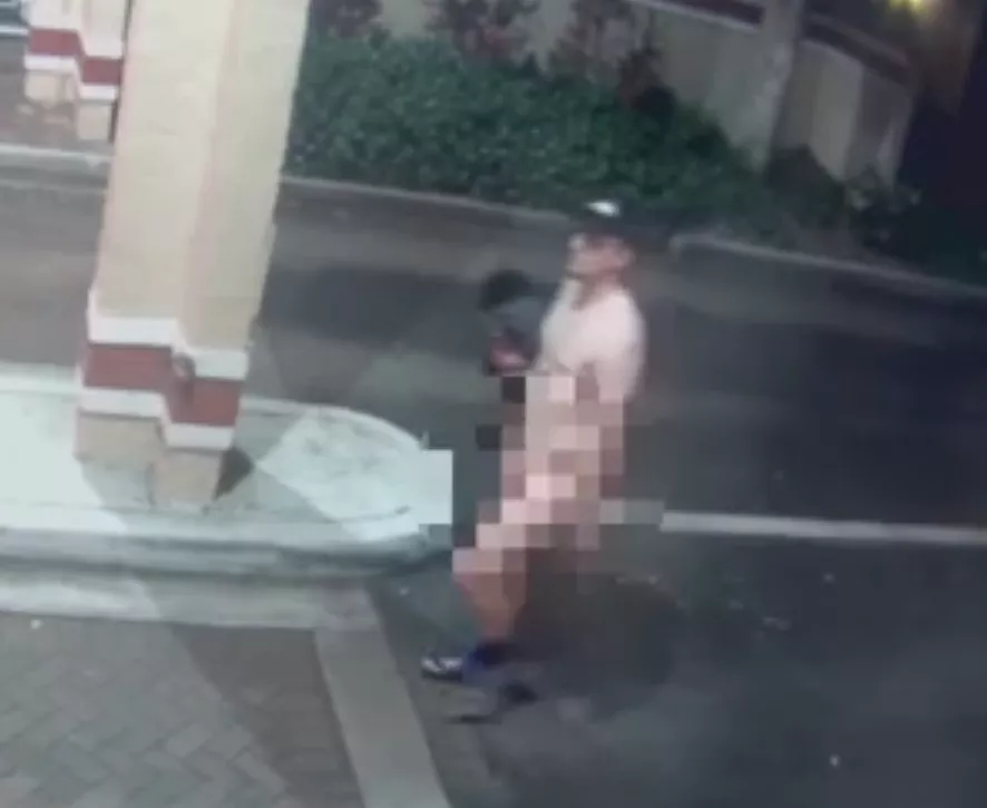 masturbating nude in public in front of police station