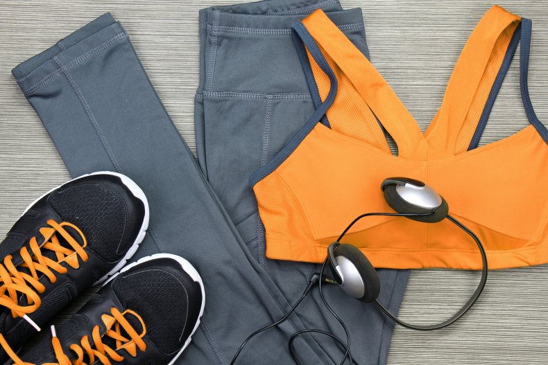 workout clothing, running shoes, headphones, smartphone, getty