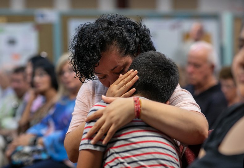 Immigrant mom hugging child