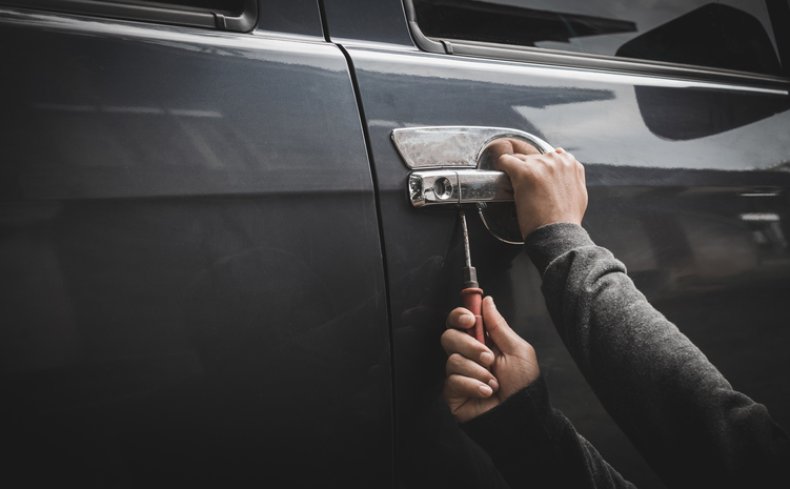 Man stealing car Man stealing car