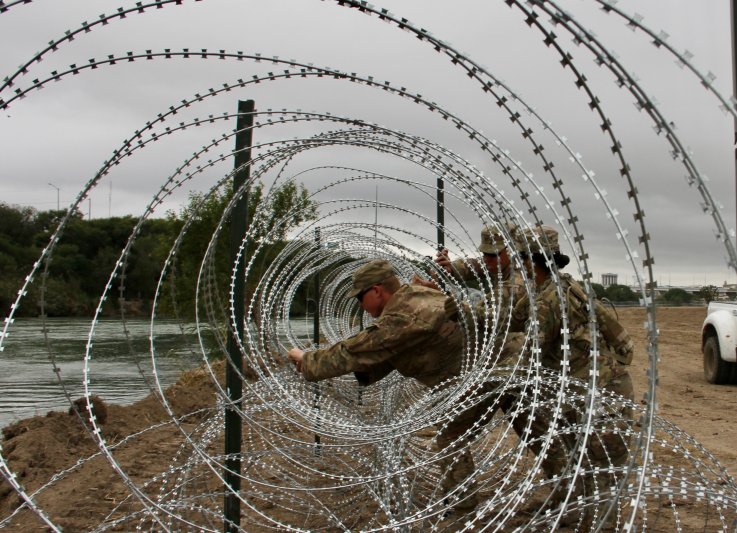 Soldier barbed wire border wall Soldier barbed wire border wall