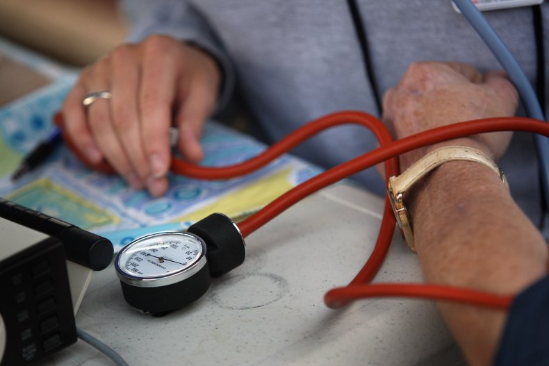 nurse checks blood pressure
