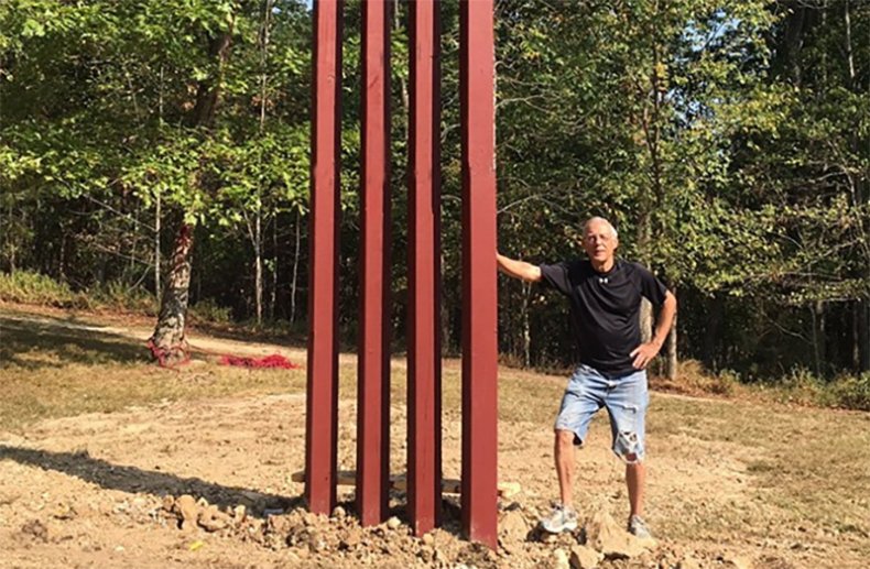 Rick Weber next to his wall