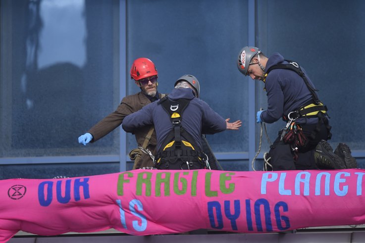 London City protest Climate Change Protester Infiltrates Plane, Is Heckled By Passengers: 'You'll Be Thrown Off By Me'