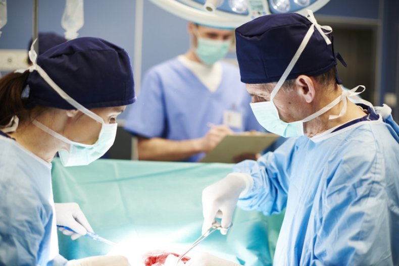 Doctors performing transplant surgery