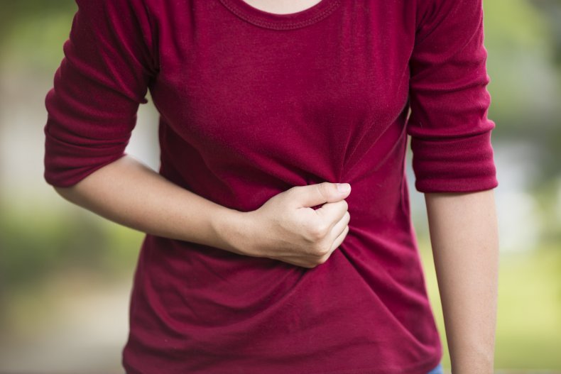 stomach ache, pain, woman, ill, sick, getty