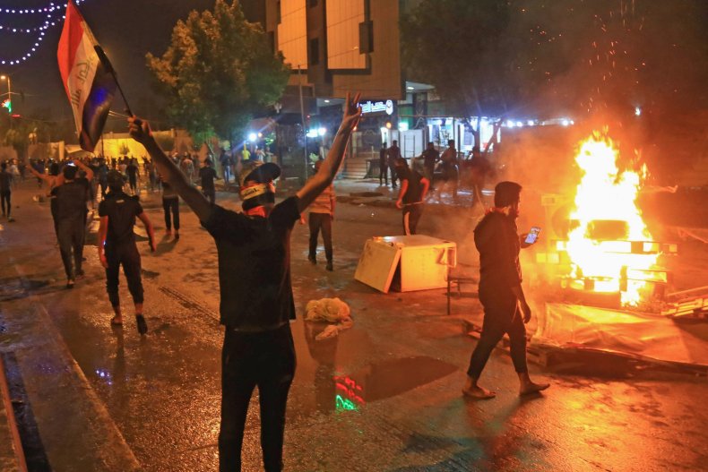 iraq protest flag fire unrest