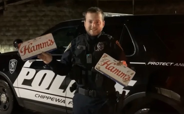 Officer Scott Schoenwetter showing off beer plates