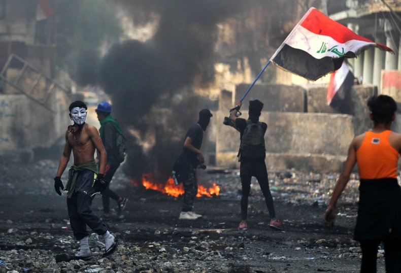 iraq baghdad protests fire flag