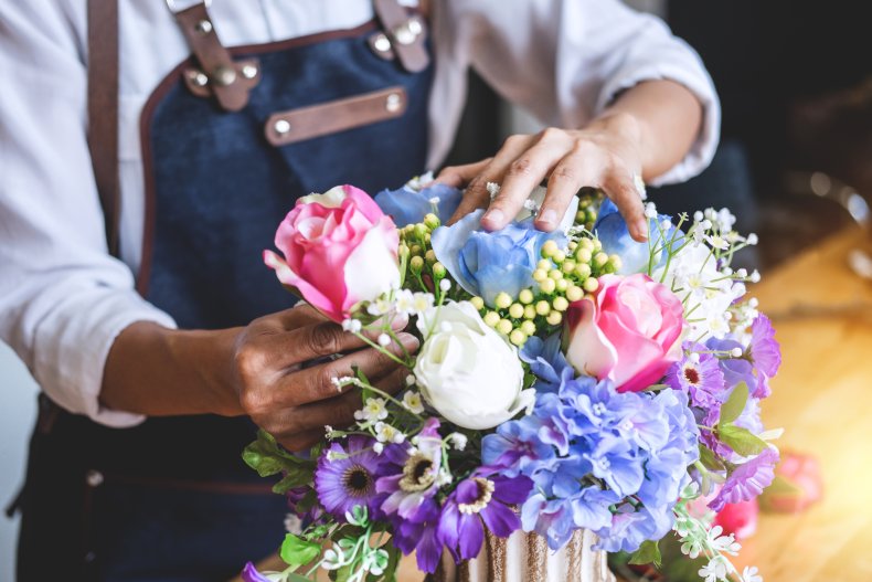 A florist arranging a bouquet