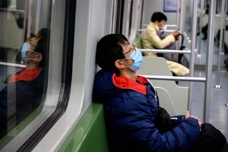Passenger wears mask on subway