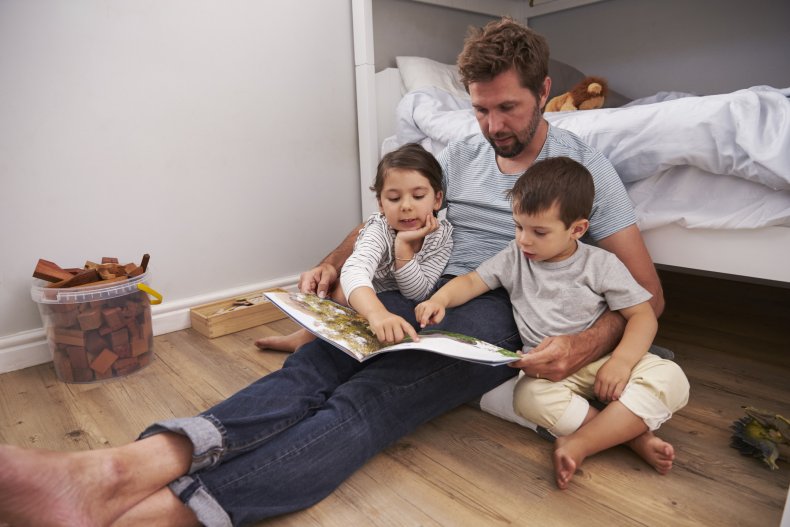father, children, boy, girl, reading, parent, stock,getty father, children, boy, girl, reading, parent, stock,getty