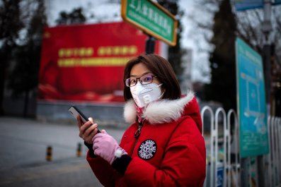A judge's gavel resting on a pile of one-dollar bills