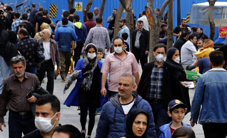 Iranians wearing masks