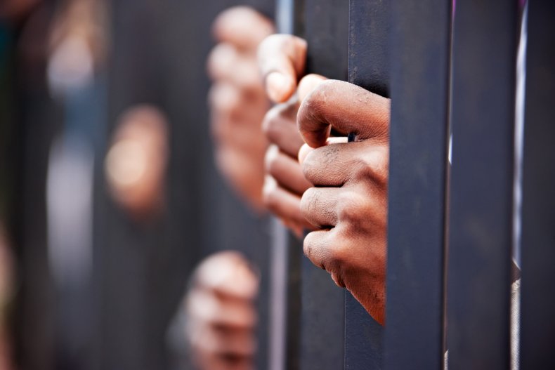 Jail Bars and Hands