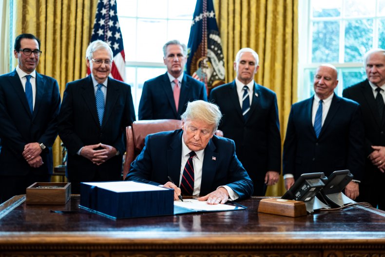 President Trump Signs Coronavirus Stimulus Bill In The Oval Office
