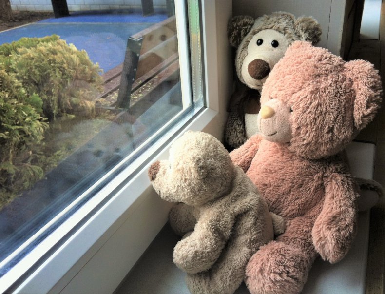 Teddy bears in window