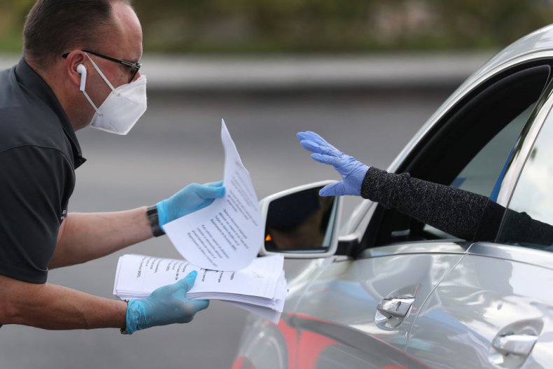 Volunteer Hands Out Unemployment Applications