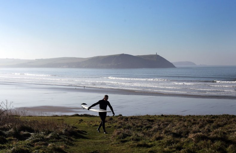 Surfer Polzeath Cornwall UK