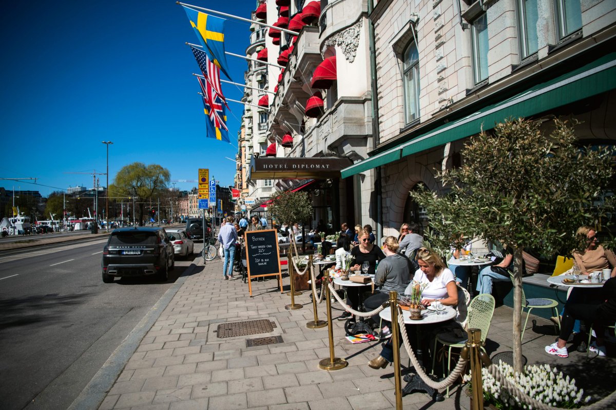 People have lunch at a restaurant in Stockholm on April 22, 2020