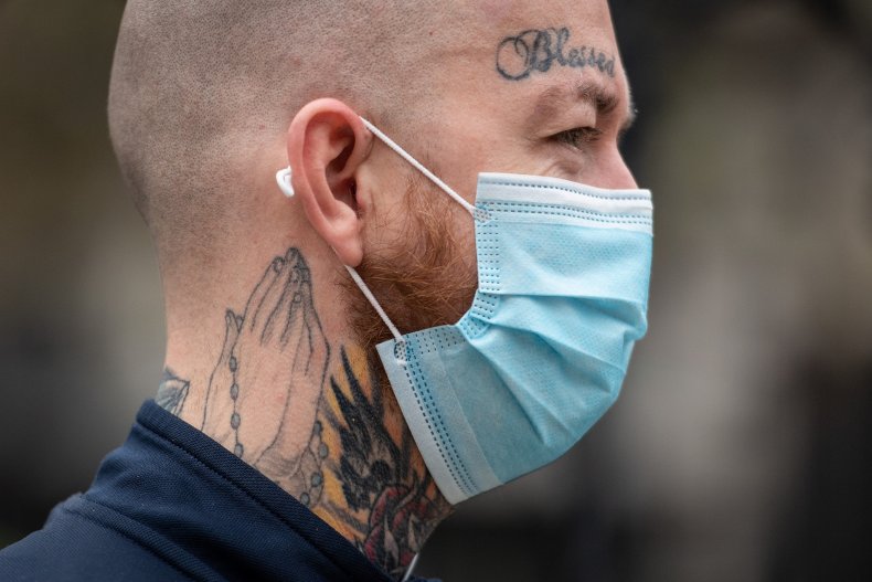 Man wears face mask walking through Westminster