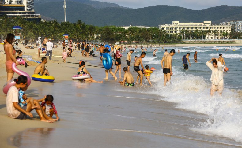 People on the beach in Sanya on China's Hainan Island, pictured on April 20, 2020.