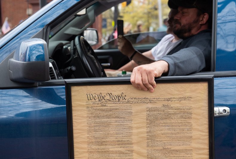 Maryland protester holding U.S. Constitution