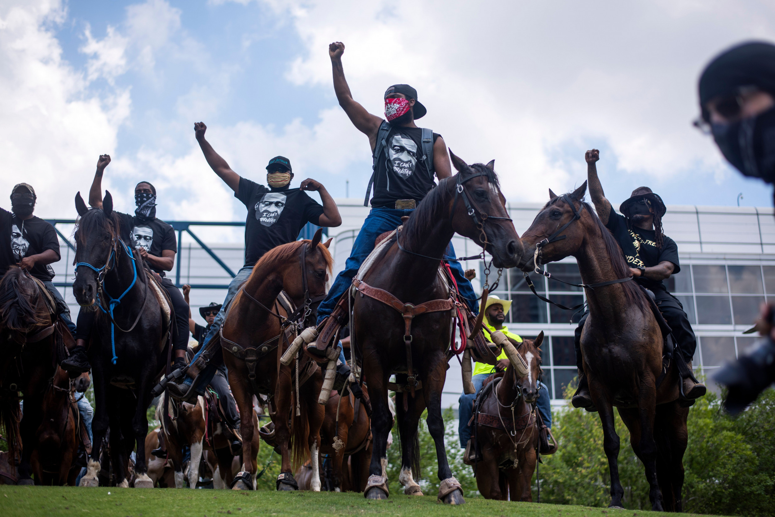 Black Cowboys Matter': Horseback protesters who grew up with George Floyd  lead the line in Houston