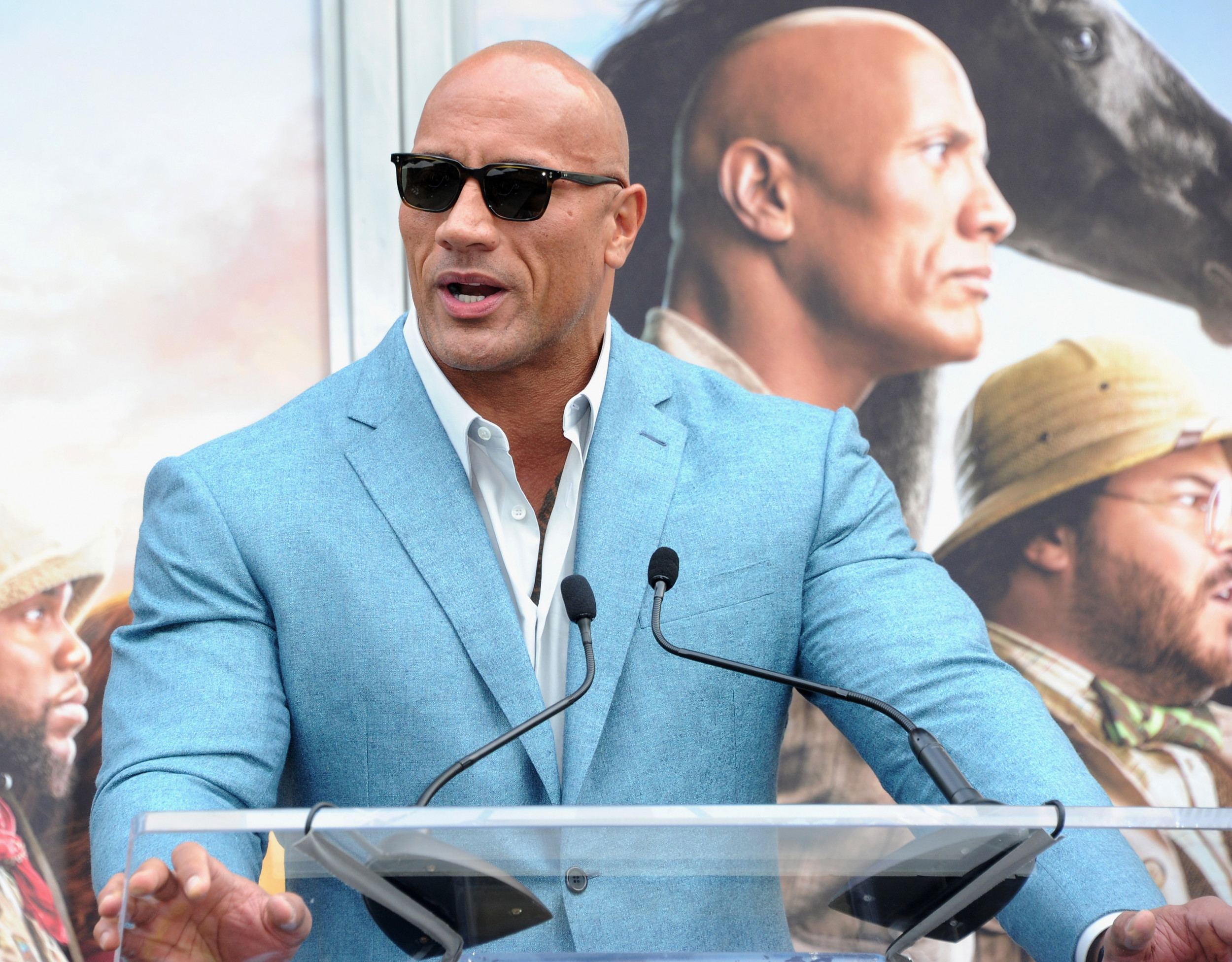 Group including Dwayne 'The Rock' Johnson buys XFL