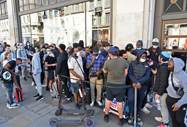 People queue outside Nike in central London